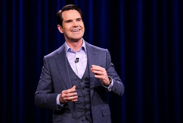 Jimmy Carr performing stand-up comedy during a live tour