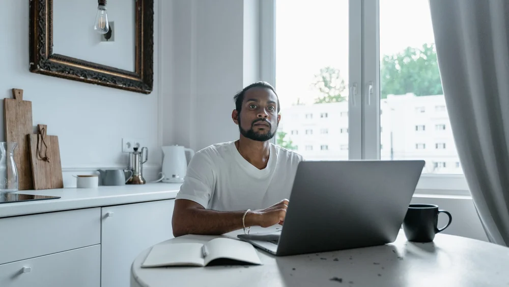 Working from a kitchen table, the reality of many hybrid roles