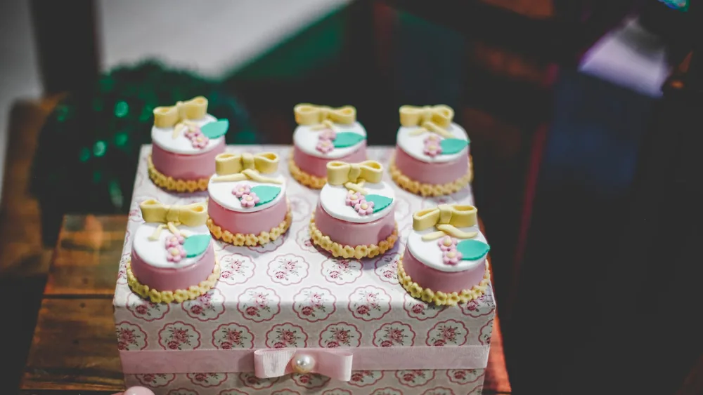 Beautifully decorated mini cakes with floral designs, perfect for elegant occasions.