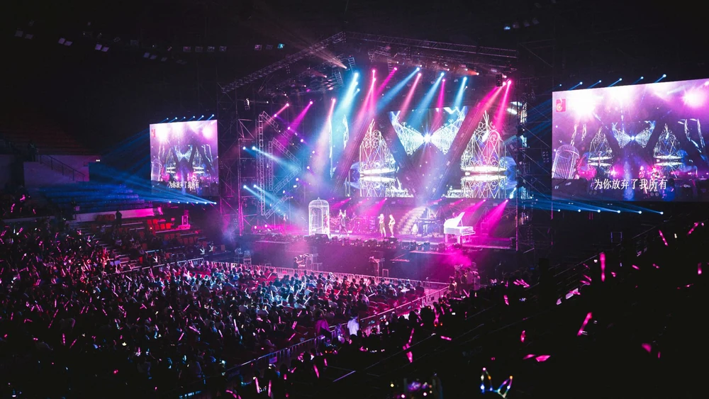 An arena crowd, the top end of the British comedy circuit