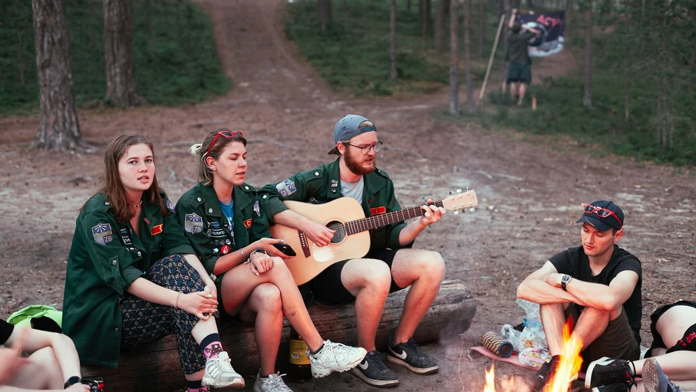 A campfire at night, the kind of scene central to Scouting