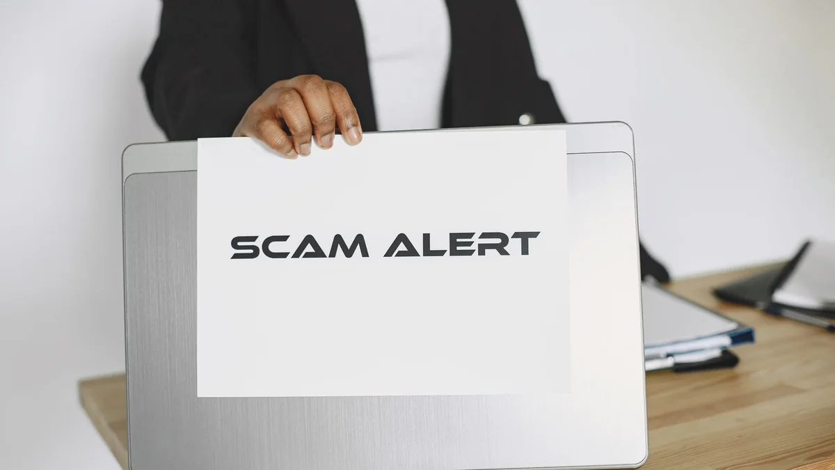 A warning on a laptop screen, representing a phishing scam