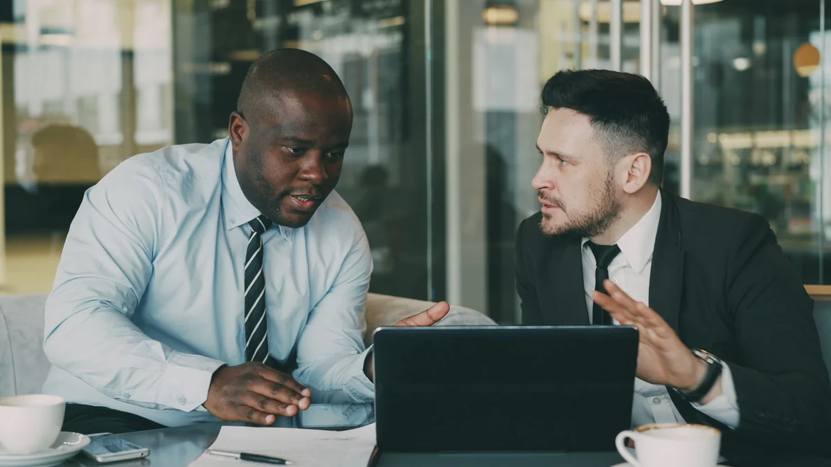 Two business partners talking through a decision