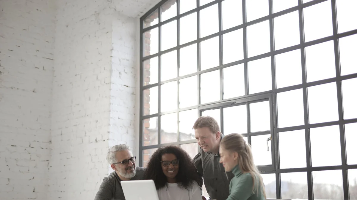 Startup founders reviewing ownership figures on a laptop