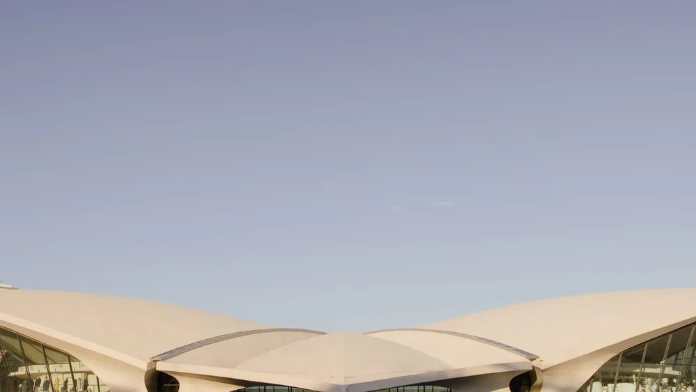 Stunning architectural design of the TWA Flight Center in New York's JFK Airport captured in daylight.