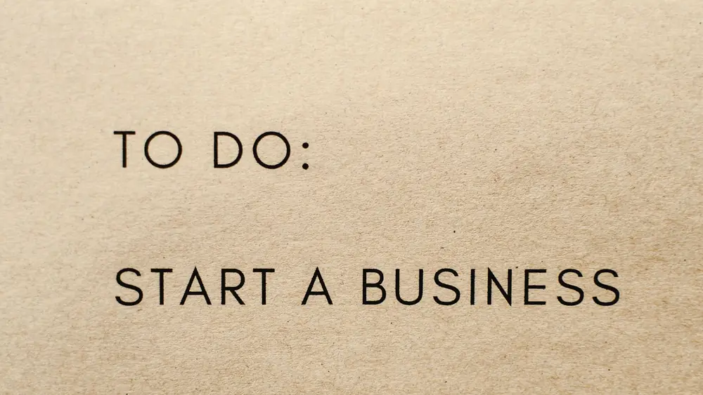 A close-up shot of a to-do list with 'Start a Business' written on it.