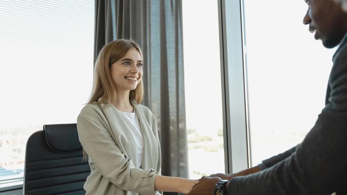 A handshake at a job interview for a small company first hire