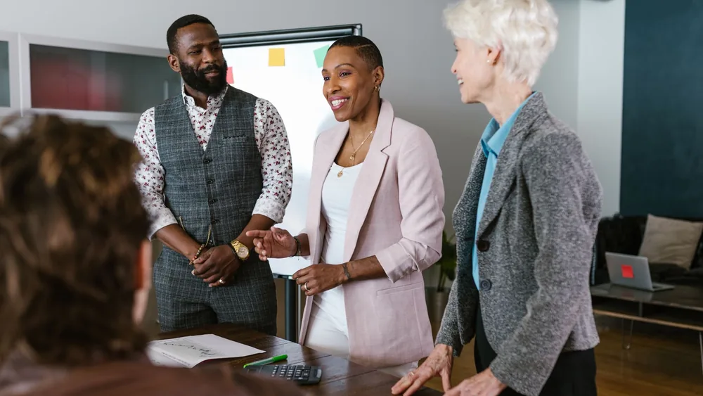 Collaborative business team engaging in a strategic meeting in a modern office setting.