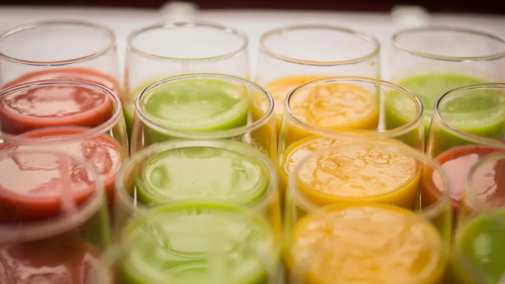 Vibrant selection of assorted fruit juices in glasses, showcasing variety and freshness.