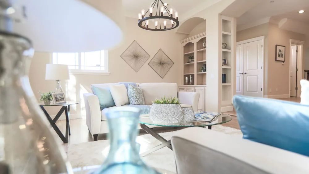 Bright and stylish living room with contemporary decor and natural lighting.