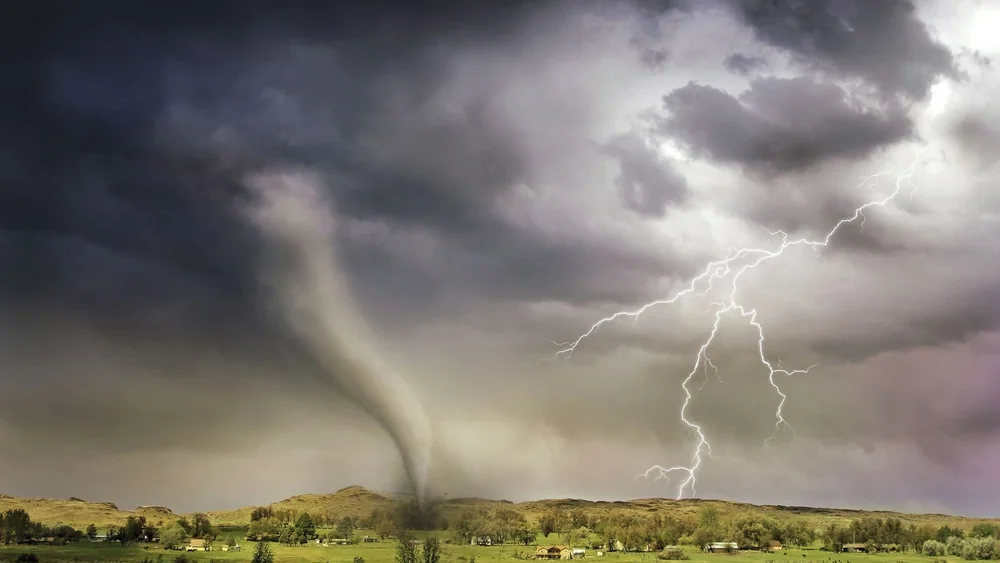 A cyclone over open ground, the weapon Morrible uses in the musical