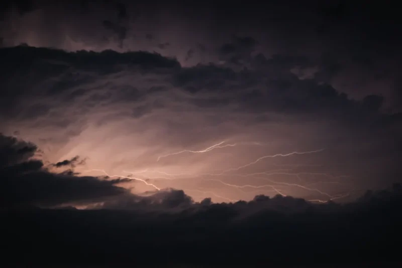 A storm sky splitting with lightning, the kind of weather Morrible commands in Wicked