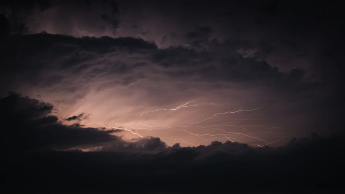 A storm sky splitting with lightning, the kind of weather Morrible commands in Wicked