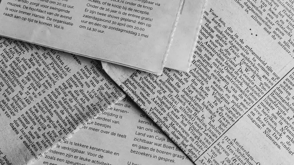 Newspapers coming off a press, the machinery of the propaganda Morrible spreads