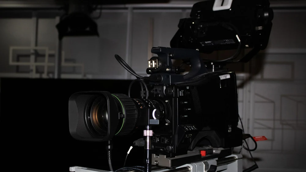 A studio camera and autocue, the working end of a news bulletin