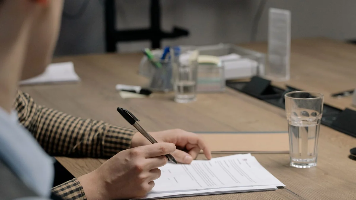 A written proposal being prepared on a desk