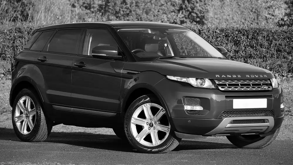Stylish black and white Range Rover Evoque parked in an outdoor setting.