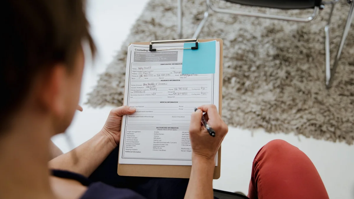 Company registration paperwork being completed on a laptop