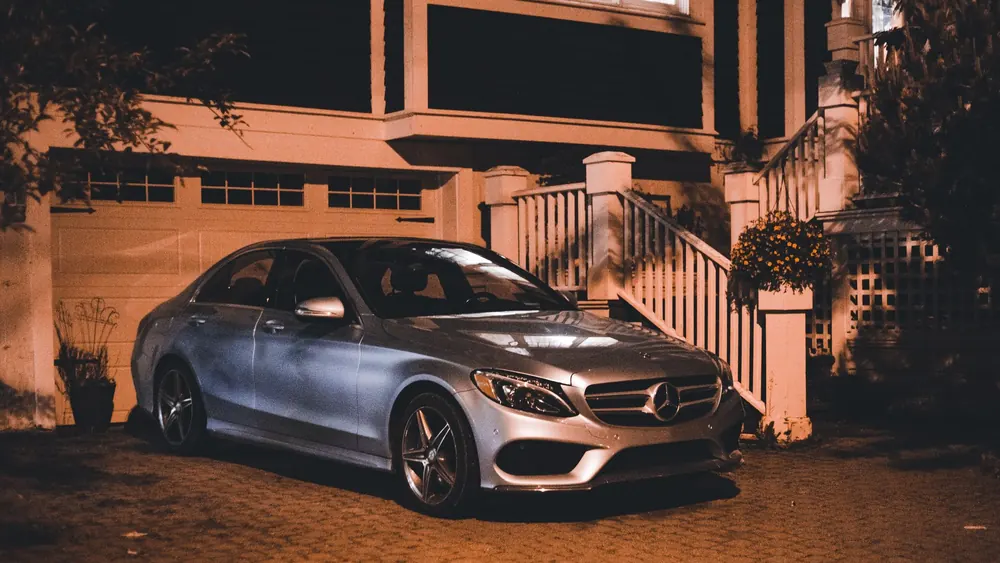 A car parked on a private driveway at night, the parking arrangement insurers ask about