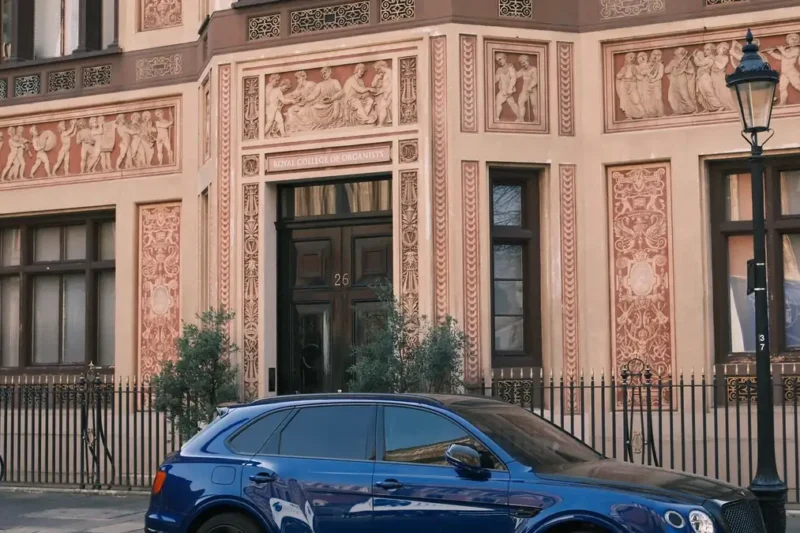 A large luxury SUV parked on a British residential street