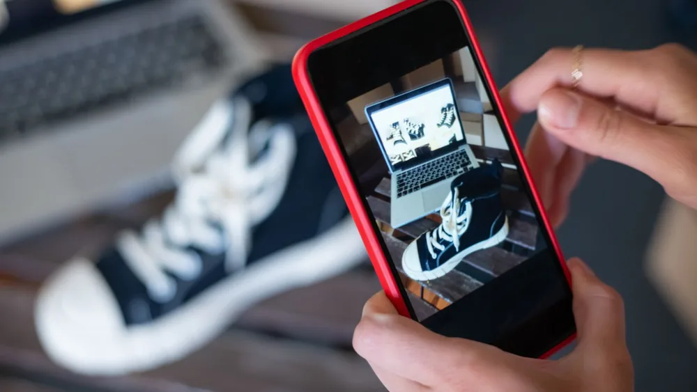 Capturing sneakers with a mobile phone for an online store showcase. E-commerce at its best.