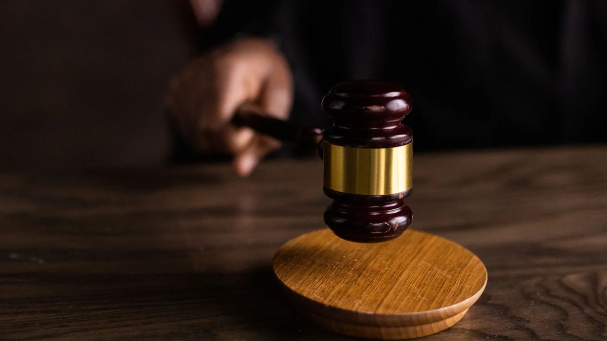 A gavel in a courtroom, where car ownership disputes are decided