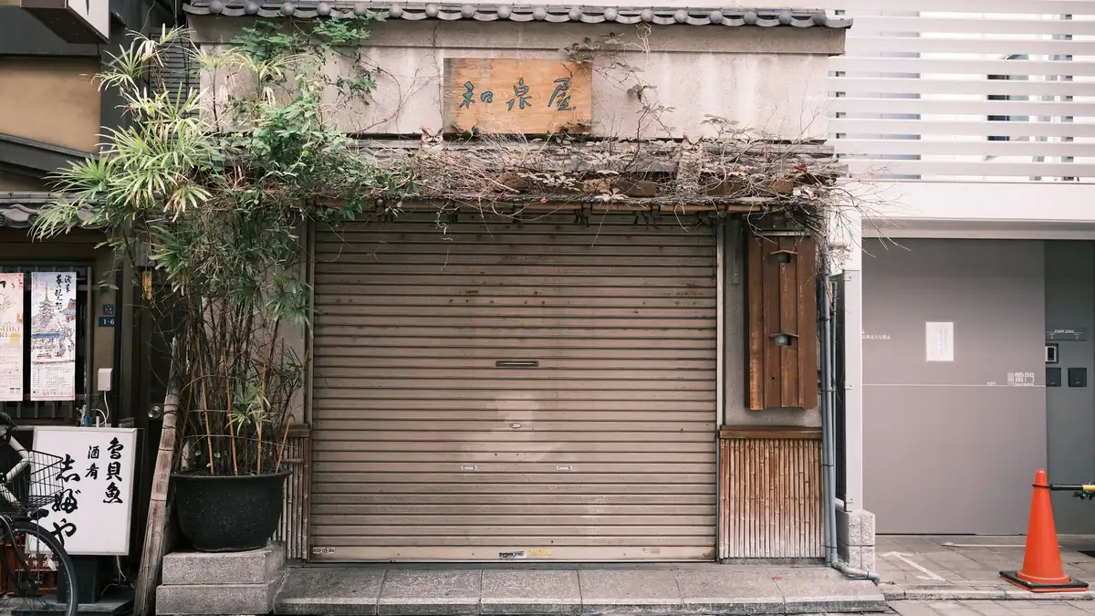A shuttered shop front during a trading downturn