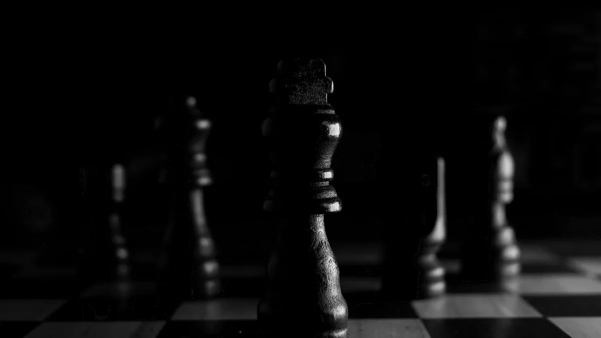 Chess pieces on a board, representing competitive strategy