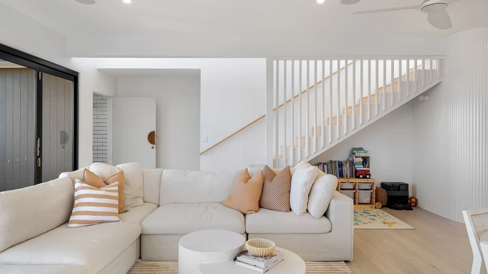 A wooden coffee table against a white scheme