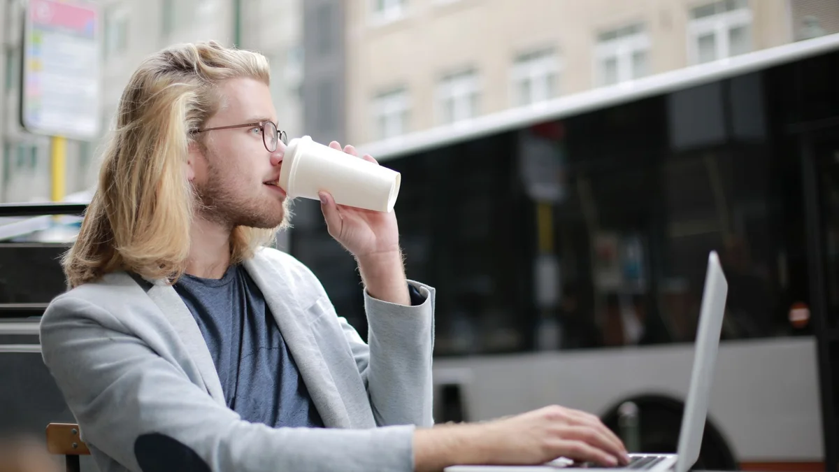 A freelancer working on a laptop away from an office